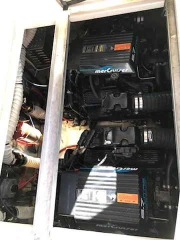 Slide: The Image of Engine compartment of 1998 Cruisers Yachts 3075 Rogue with MerCruiser engines. - 22