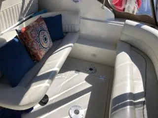 Slide: The Image of 1998 Cruisers Yachts 3075 Rogue interior with lake view and docked boats. - 5