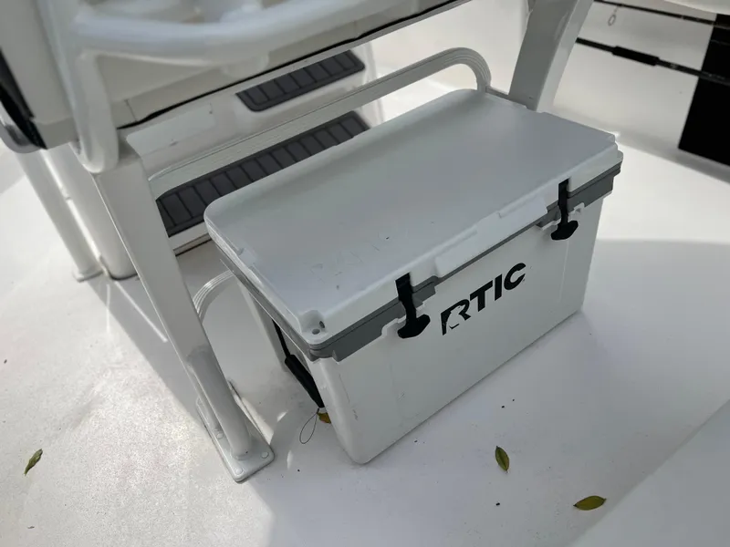 Slide: The Image of 2023 Tidewater 220 CC Adventure boat seat with built-in rod holders. - 17