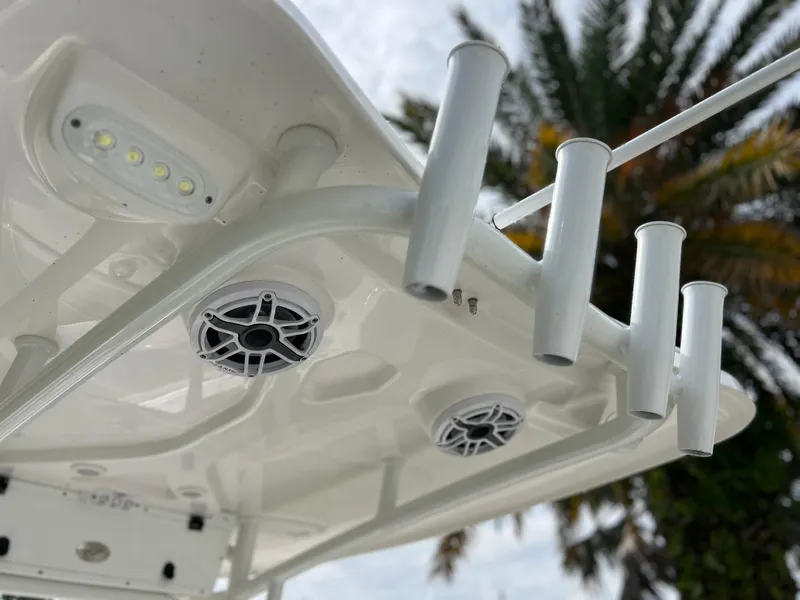 Slide: The Image of 2023 Tidewater 220 CC Adventure boat livewell and seating area. - 19