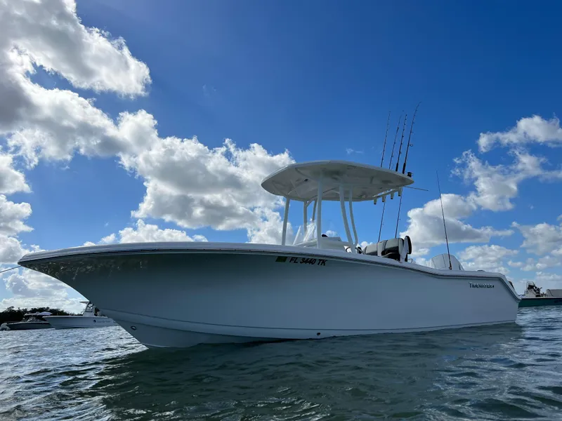 Slide: The Image of 2023 Tidewater 220 CC Adventure boat on a Rocket trailer at night. - 7