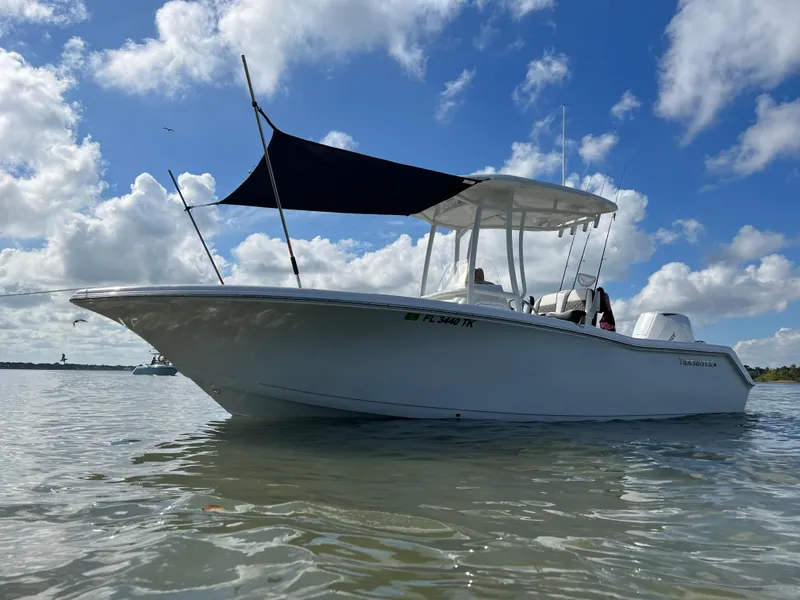 Slide: The Image of Aerial view of a 2023 Tidewater 220 CC Adventure boat in clear water. - 9