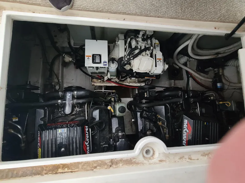 Slide: The Image of 1995 Cruisers Rogue engine compartment with twin MerCruiser engines. - 19
