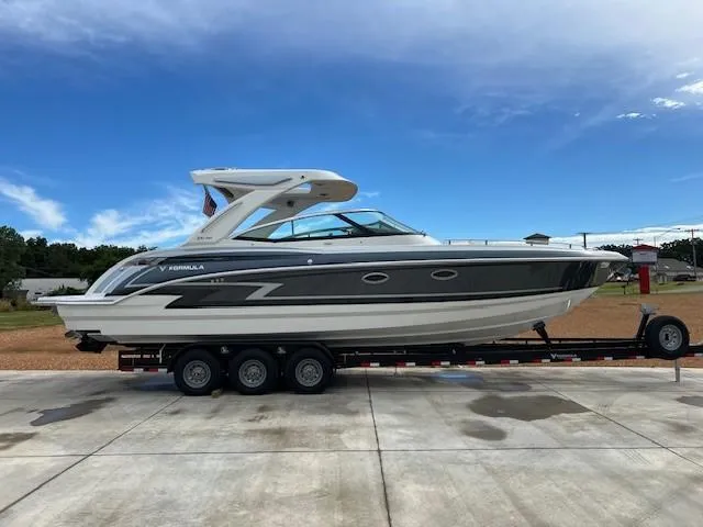 The Image of 2025 Formula 330 Crossover Bowrider I/O on a trailer, side view. - 1