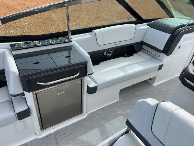 Slide: The Image of Interior of 2025 Formula 330 Crossover Bowrider I/O with seating and mini-fridge. - 11