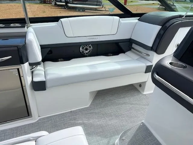Slide: The Image of 2025 Formula 330 Crossover Bowrider I/O interior seating area with white upholstery. - 14