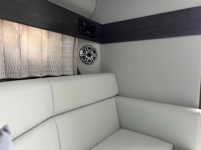Slide: The Image of Interior of 2025 Formula 330 Crossover Bowrider I/O with modern seating and audio system. - 21