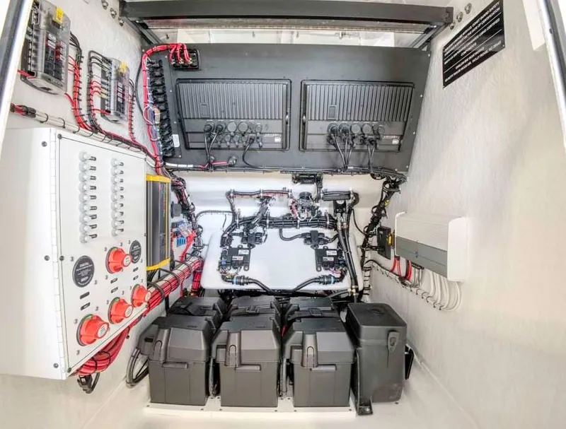 Slide: The Image of 2025 Onslow Bay 27 Offshore Edition electrical system and battery compartment. - 13