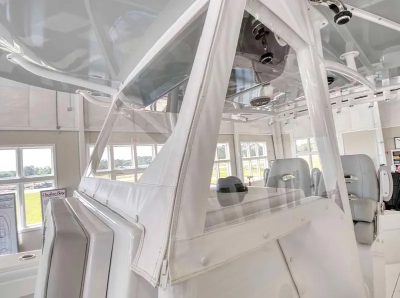 Slide: The Image of 2025 Onslow Bay 27 Offshore Edition boat interior with white seating and modern design. - 3