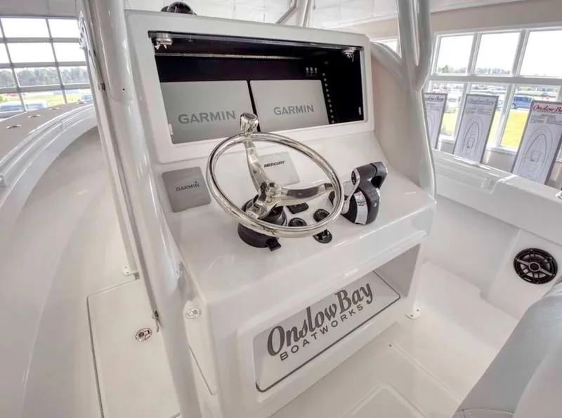Slide: The Image of 2025 Onslow Bay 27 Offshore Edition boat console with Garmin navigation system. - 4