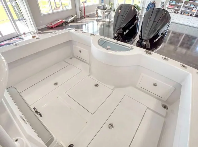 Slide: The Image of 2025 Onslow Bay 27 Offshore Edition boat interior with twin Mercury engines. - 6