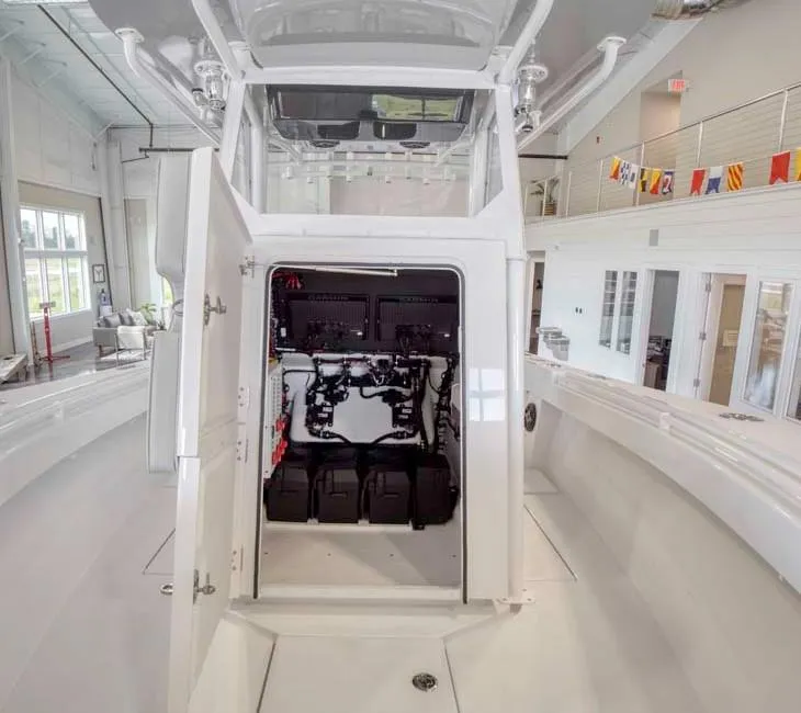 Slide: The Image of 2025 Onslow Bay 27 Offshore Edition boat interior with open electronics compartment. - 9