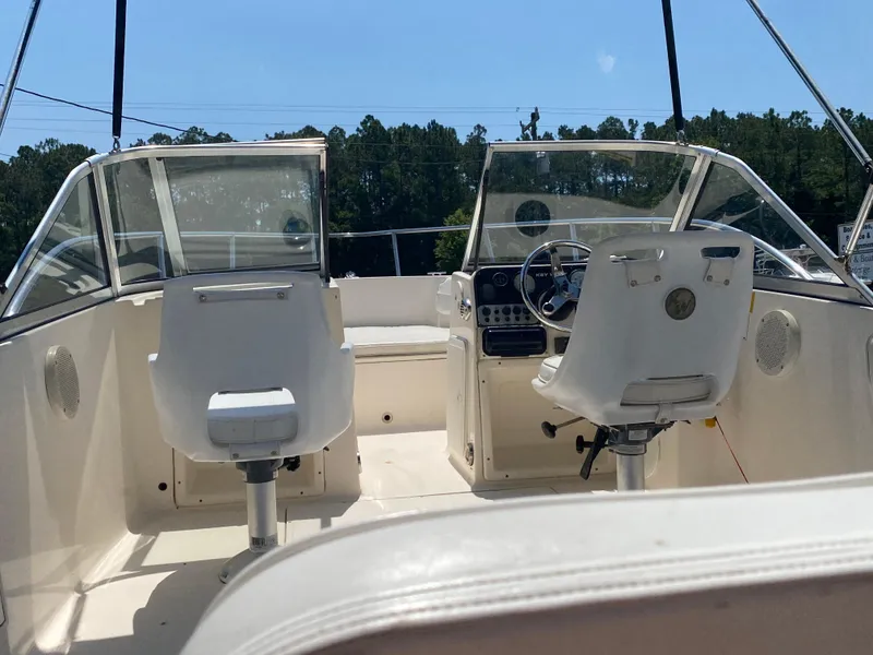 Slide: The Image of Interior of a 2005 Key West 2020 SE boat with dual captain chairs. - 5