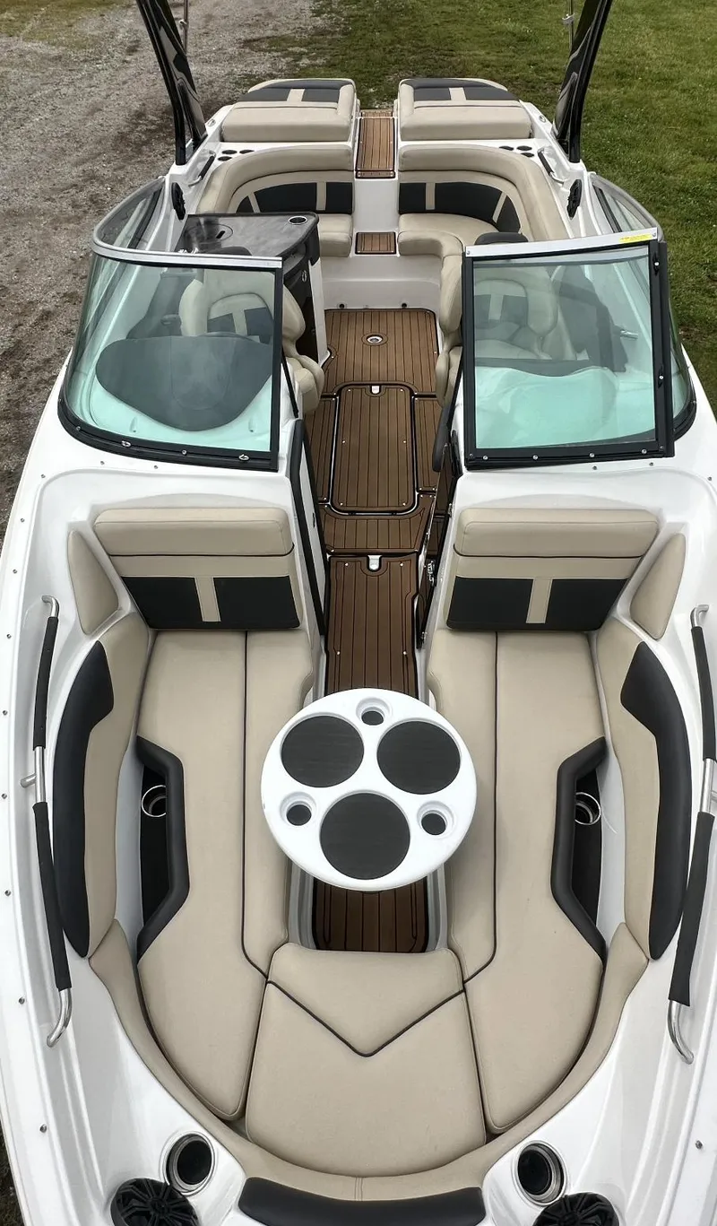 Slide: The Image of 2018 Rinker QX29 BR boat with spacious seating and modern interior design. - 10