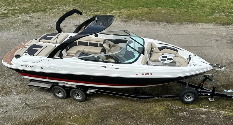Slide: The Image of 2018 Rinker QX29 BR boat on a trailer, top view. - 2