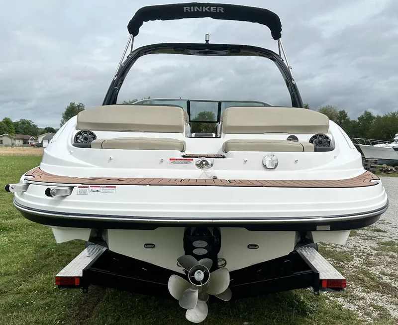 Slide: The Image of 2018 Rinker QX29 BR boat rear view with swim platform and propeller. - 5