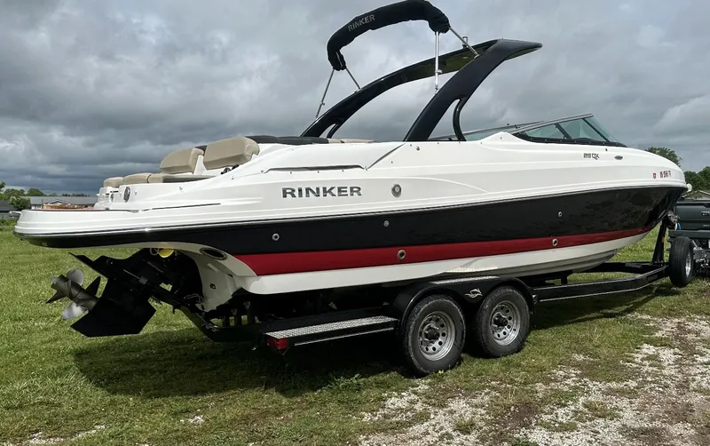 Slide: The Image of 2018 Rinker QX29 BR boat on a trailer, side view. - 6