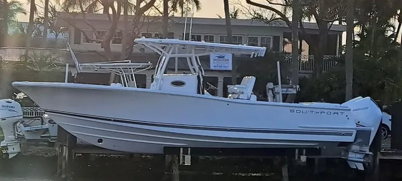 Slide: The Image of 2024 Southport 30 FE boat docked, side view. - 1