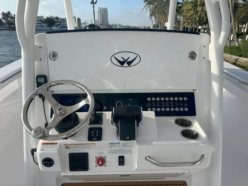 Slide: The Image of 2024 Southport 30 FE boat helm with steering wheel and control panel. - 10