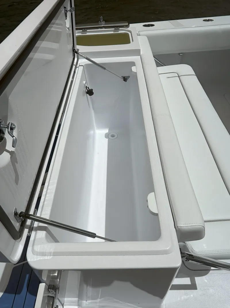 Slide: The Image of 2024 Southport 30 FE boat with open storage compartment. - 17
