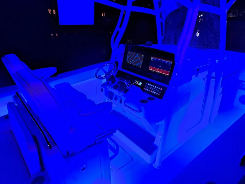 Slide: The Image of 2024 Southport 30 FE boat interior with blue LED lighting and advanced navigation system. - 23