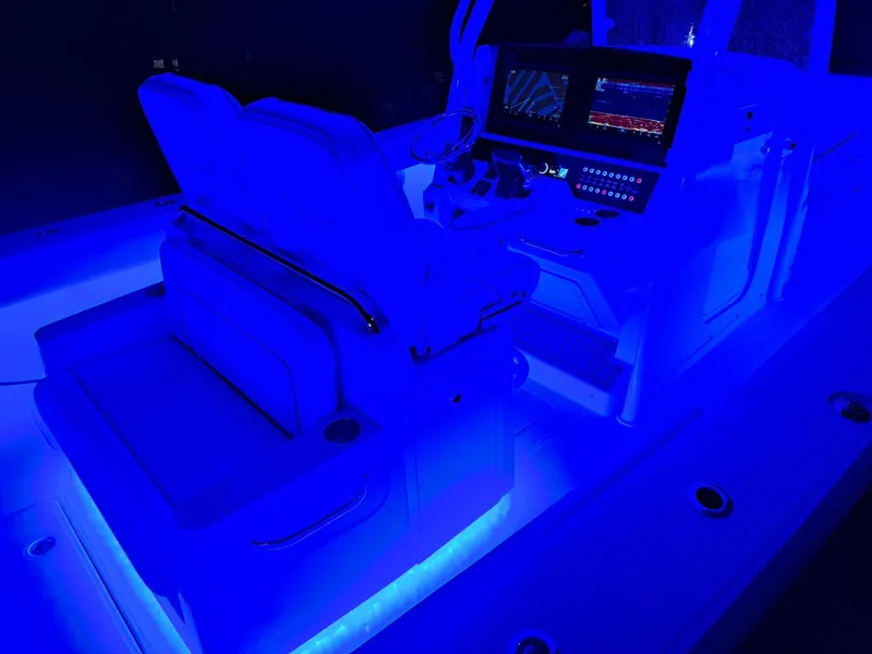 Slide: The Image of 2024 Southport 30 FE boat interior with blue LED lighting and advanced navigation system. - 36