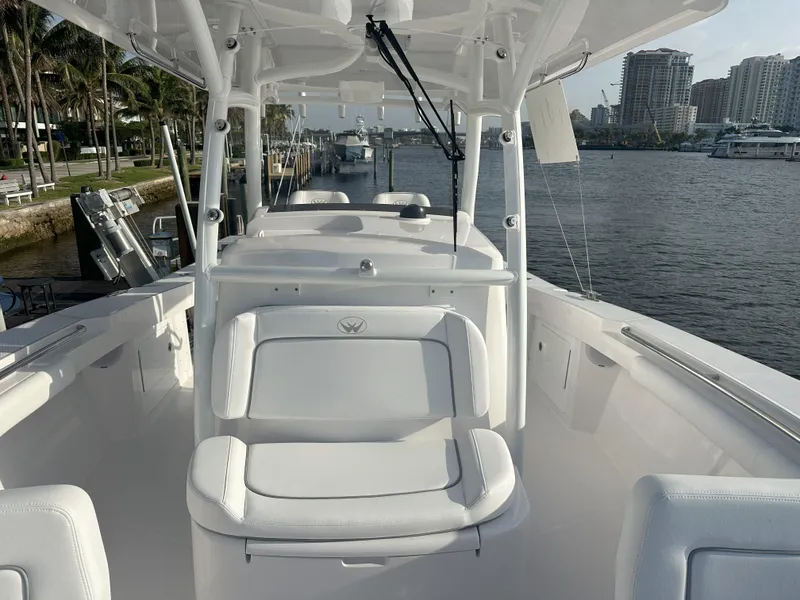 Slide: The Image of 2024 Southport 30 FE boat interior with white seating and waterfront view. - 6