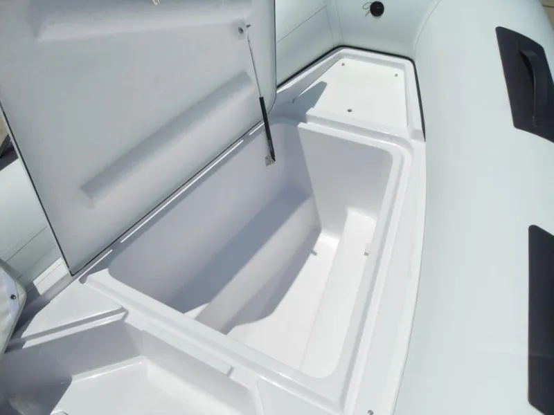 Slide: The Image of Open storage compartment on a 2025 Ranieri CAYMAN 19 Sport boat. - 16