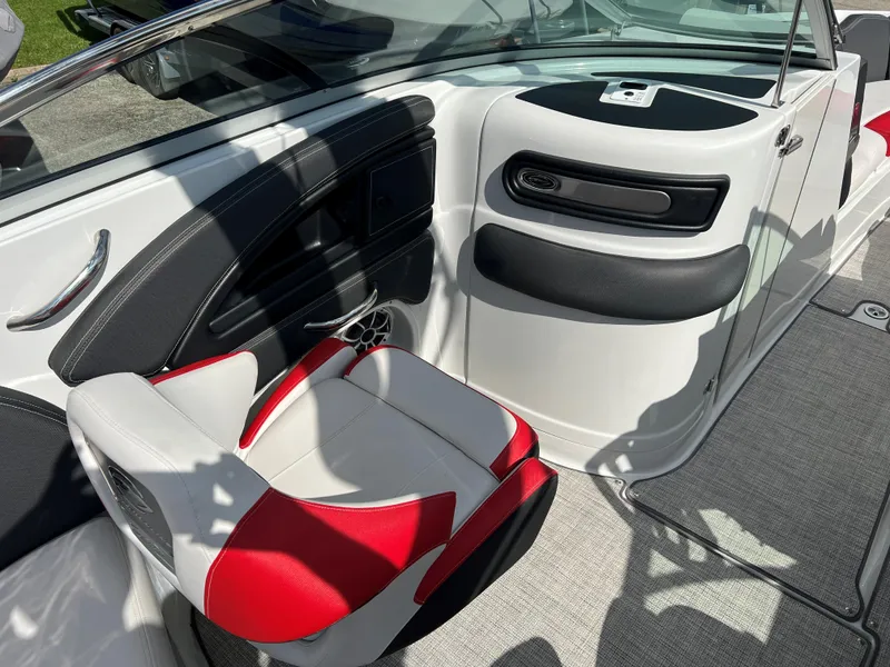 Slide: The Image of 2022 Crownline 265 SS boat interior with red and white seating. - 10
