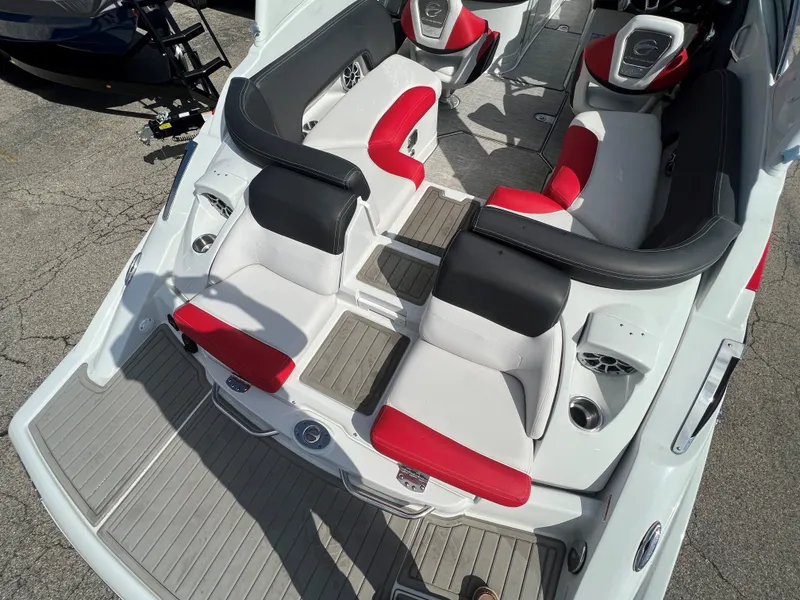 Slide: The Image of 2022 Crownline 265 SS boat interior with red and white seating. - 4