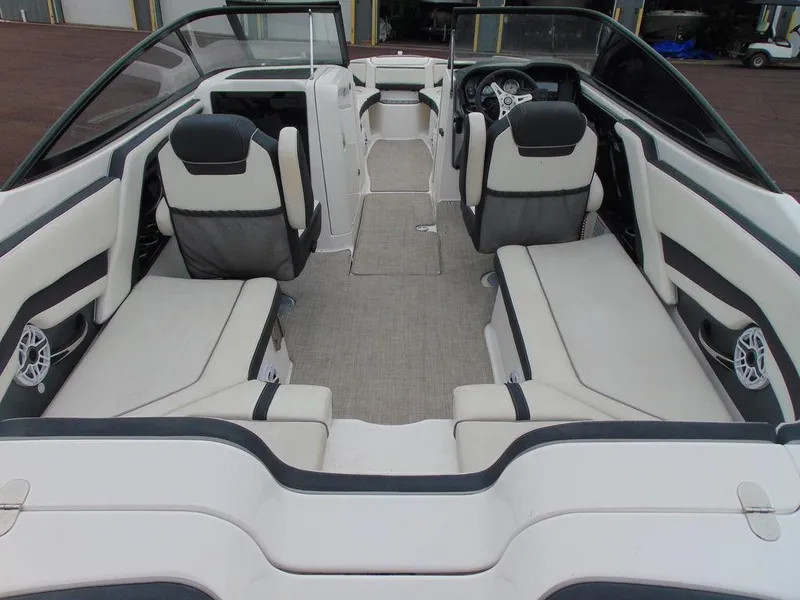 Slide: The Image of 2016 Yamaha Boats 242 Limited interior seating and cockpit view. - 5