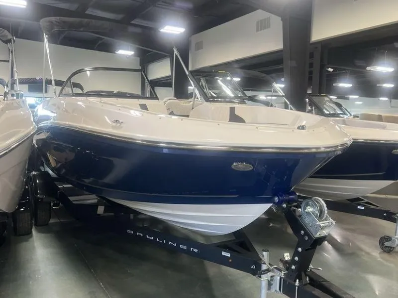 The Image of 2023 Bayliner VR5 Bowrider I/O on display in a showroom. - 0