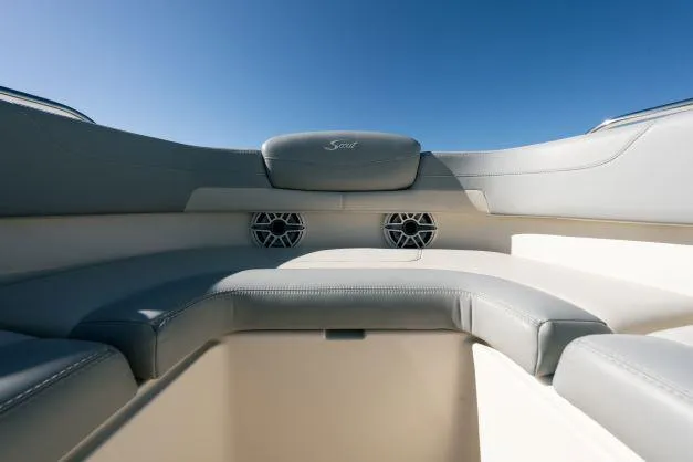 Slide: The Image of 2021 Scout 277 Dorado boat interior with cushioned seating and speakers. - 19