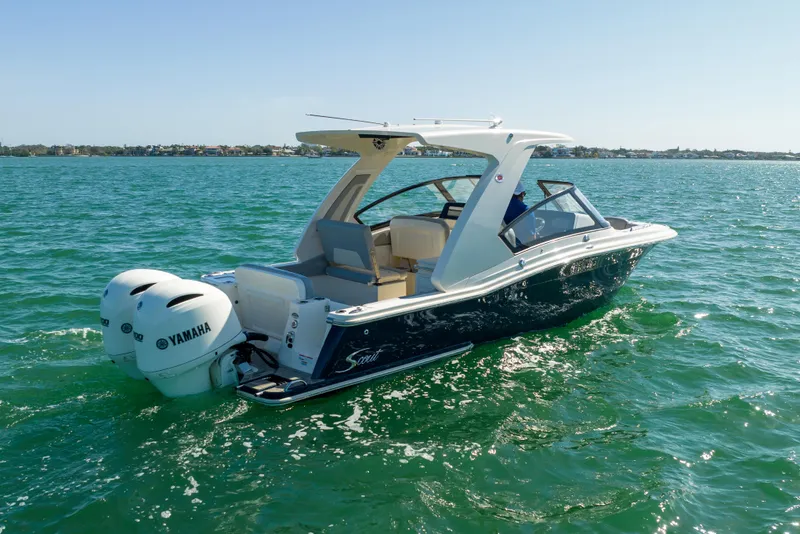 Slide: The Image of 2021 Scout 277 Dorado boat with Yamaha engines on the water. - 23