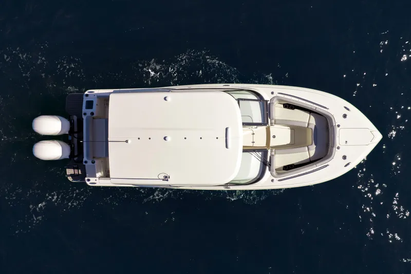 Slide: The Image of Top view of a 2021 Scout 277 Dorado boat cruising on water. - 27