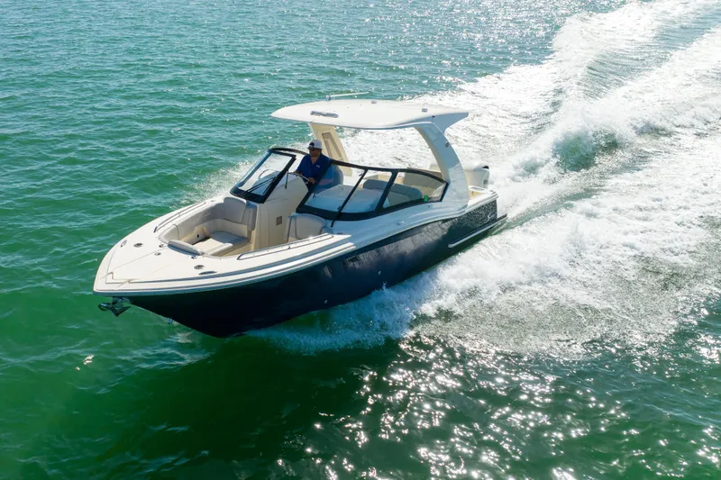 Slide: The Image of 2021 Scout 277 Dorado boat cruising on open water. - 30