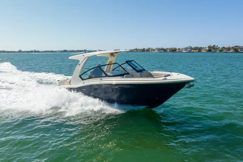 Slide: The Image of 2021 Scout 277 Dorado boat cruising on open water. - 31