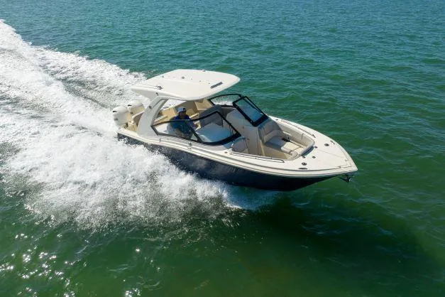 Slide: The Image of 2021 Scout 277 Dorado boat cruising on open water. - 32