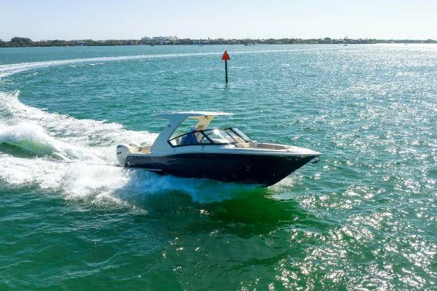 Slide: The Image of 2021 Scout 277 Dorado boat cruising on open water. - 33