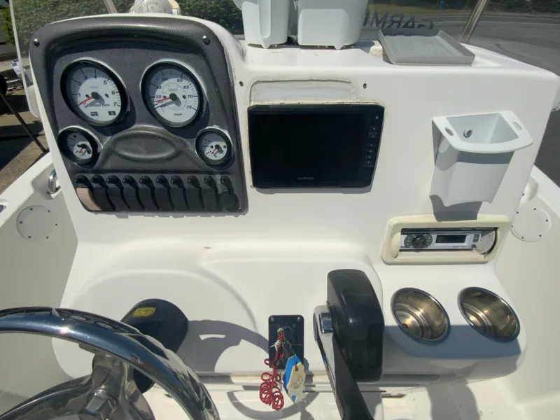 Slide: The Image of Control panel of a 2014 Tidewater 196 CC Adventure boat with gauges and electronics. - 12