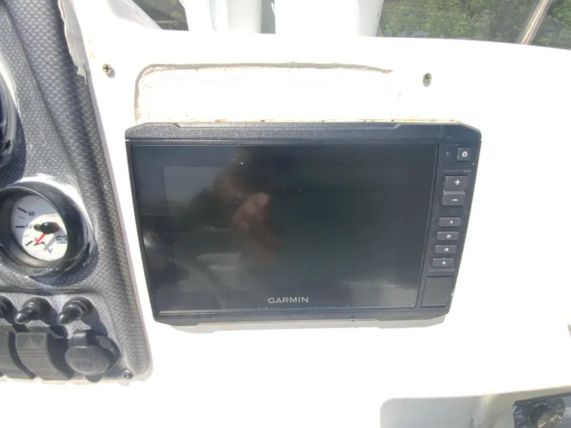 Slide: The Image of Garmin display on 2014 Tidewater 196 CC Adventure boat dashboard. - 13