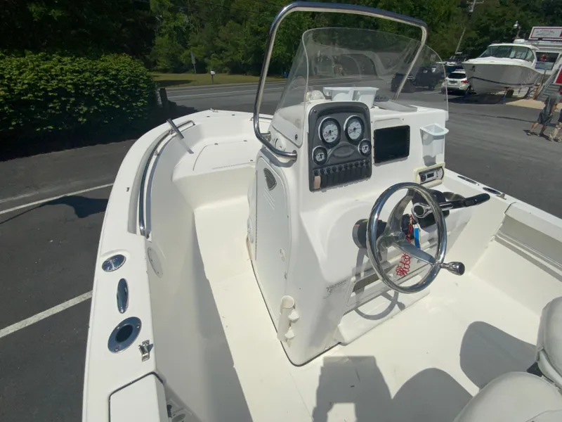 Slide: The Image of 2014 Tidewater 196 CC Adventure boat interior with steering console and gauges. - 15