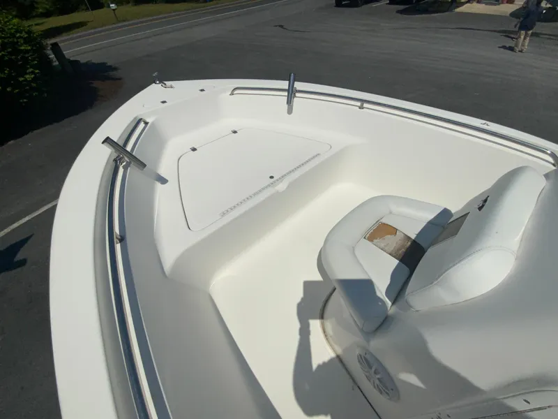 Slide: The Image of 2014 Tidewater 196 CC Adventure boat interior with seating and storage compartment. - 16