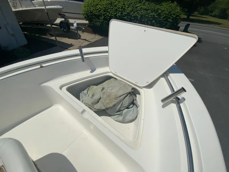 Slide: The Image of 2014 Tidewater 196 CC Adventure boat with open storage compartment. - 17