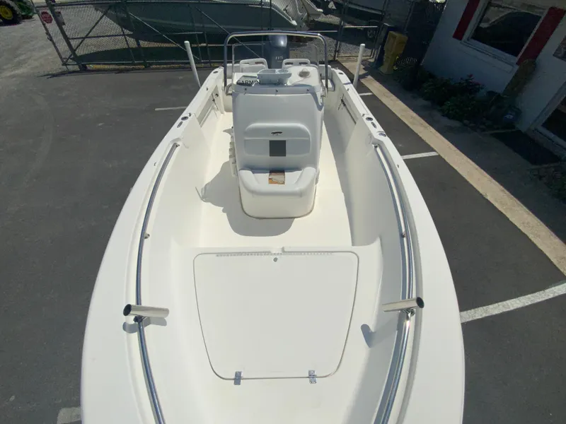 Slide: The Image of 2014 Tidewater 196 CC Adventure boat, top view, parked on asphalt. - 20