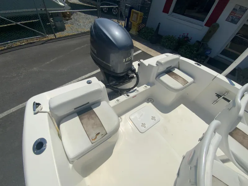 Slide: The Image of 2014 Tidewater 196 CC Adventure boat with seating and outboard motor. - 23