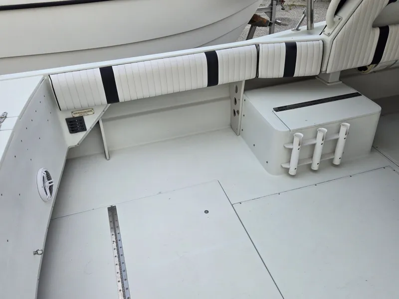 Slide: The Image of 1992 Stamas 288 Liberty boat interior with white seating and storage compartments. - 16