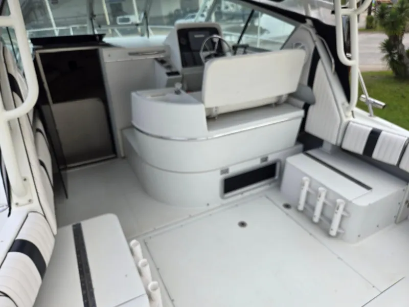 Slide: The Image of Interior view of a 1992 Stamas 288 Liberty boat, featuring seating and steering area. - 18