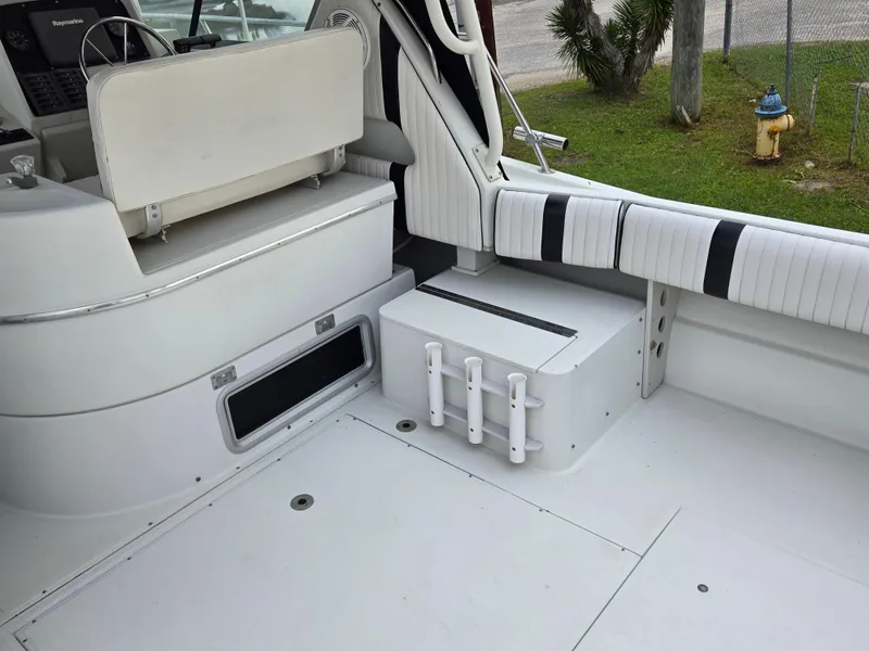 Slide: The Image of Interior of 1992 Stamas 288 Liberty boat with white seating and storage compartments. - 19