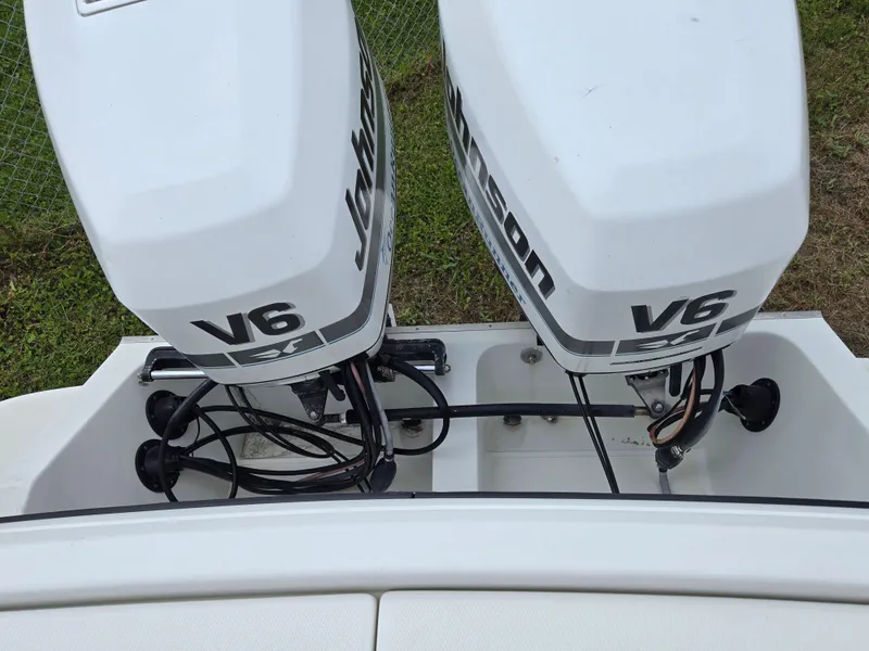 Slide: The Image of Twin Johnson V6 outboard engines on a 1992 Stamas 288 Liberty boat. - 22